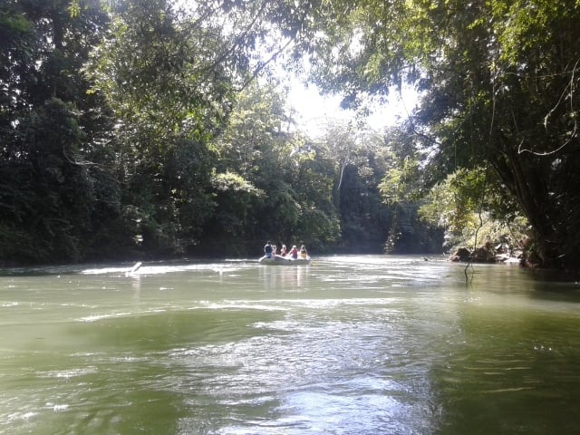 Travellers on an inflatable boat on a river