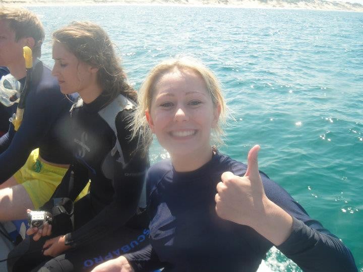 Georgia on a boat giving a thumbs up