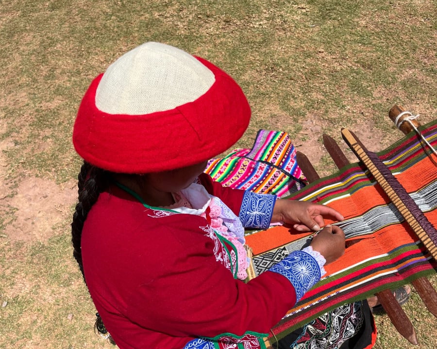 Local lady in Ccaccaccollo working at a weaving co-op, Peru 