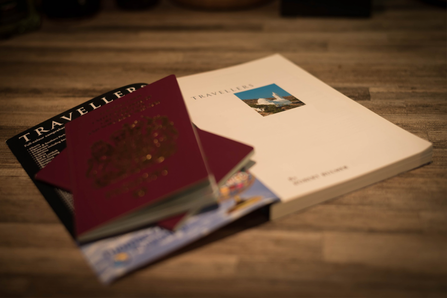 Two British passports inside a travel guidebook
