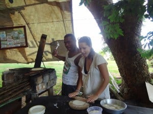 Two people preparing Roti outdoors