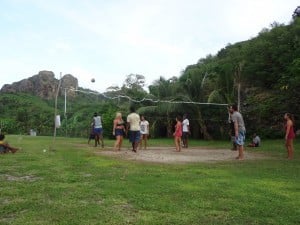 A group of people playing Volleyball