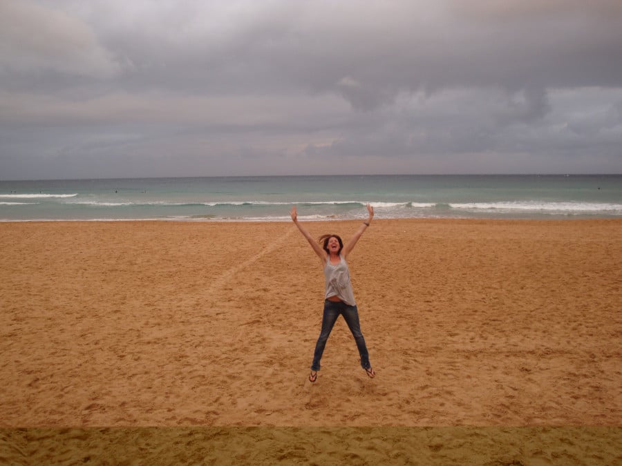 Jane jumping on a Sydney beach
