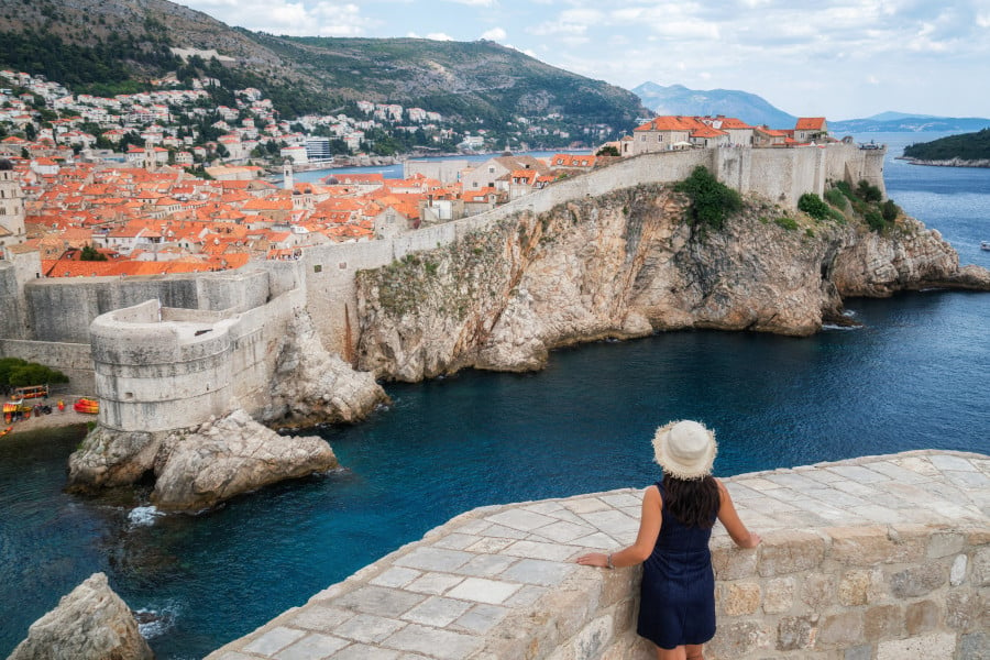 Traveller looking across to Dubrovnik City Wall, Croatia 