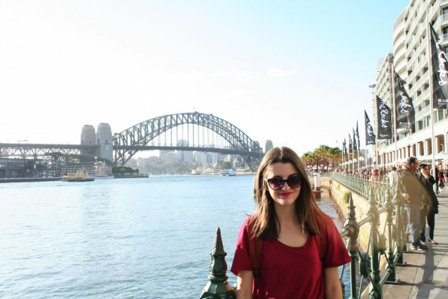Person standing in front of Sydney Harbour Bridge