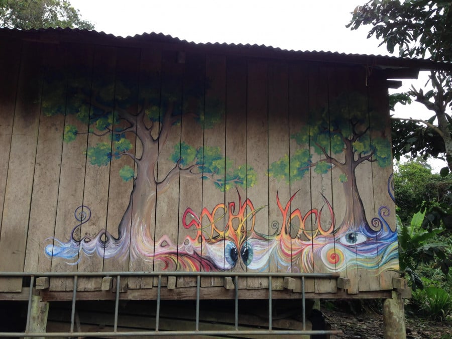 Wooden hut with trees painted on