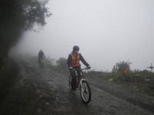 Jane on her bike, riding down the world's most dangerous road