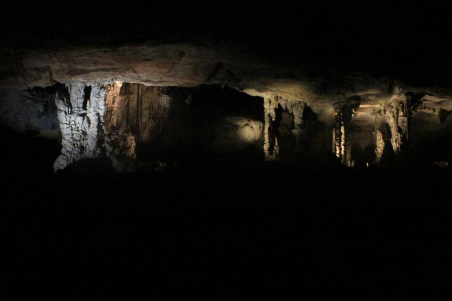 Stalactites lit up inside a cave