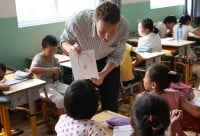 Earn $12,000 teaching in China or Thailand