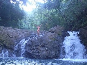 Jenny standing atop a small waterfall