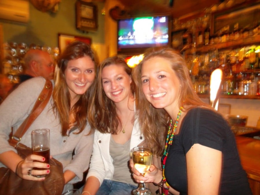 Three ladies with drinks in a bar