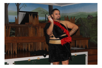 A Maori man in traditional garb