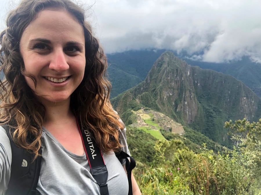 A selfie of a traveller with Machu Picchu in the background
